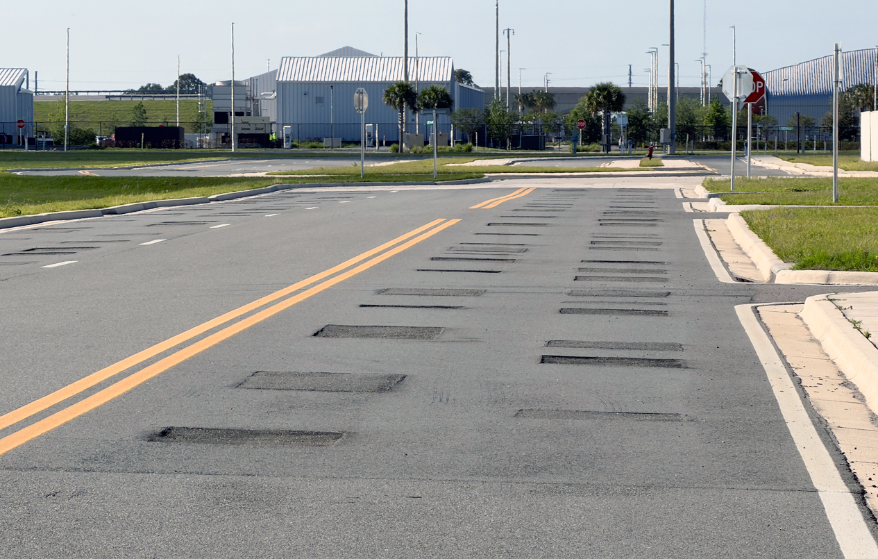 This is a picture of road damage asphalt at the Suburban Sector.