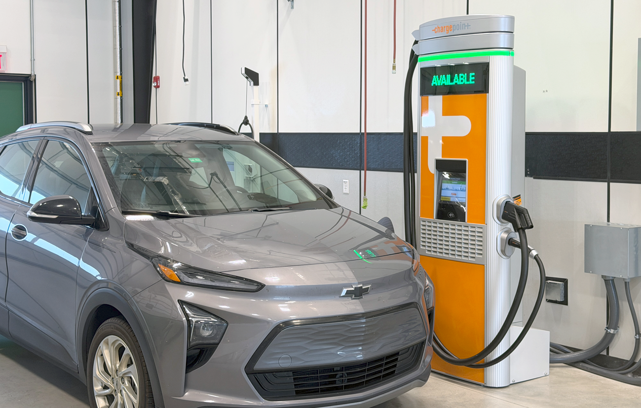 This is a picture of a Level 1 charger and a car at a Workshop Bay.